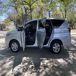 2019 silver toyota innova left side open doors.