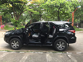 SUV 2017 Toyota Fotuner left side view with doors open