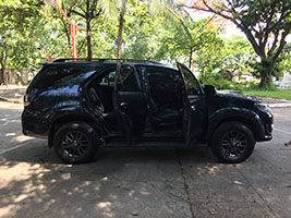 black SUV toyota fortuner 2105 left side with doors open