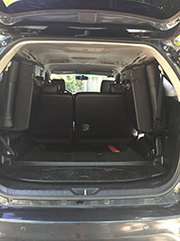 black SUV toyota fortuner 2105 rear with cabin view