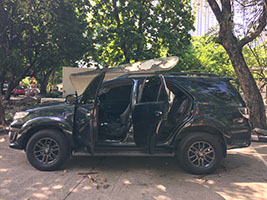 black SUV toyota fortuner 2105 right side with doors open