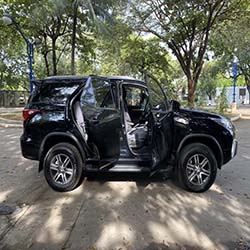 black fortuner suv for hire right side doors open
