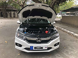 honda city car for rent in manila front view hood open