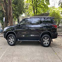 left view black fortuner suv for hire